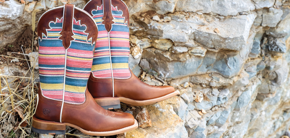 women's cowgirl boots on rocks