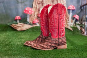 red ladies boots on fake grass
